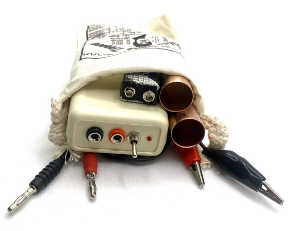 Hulda Clark Zapper with red/black leads, copper pipes, 9 volt battery, and canvas carry-all bag.